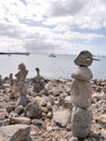 Beach art piles of rocks looking out over the bay at Playa Blanca Lanzarote