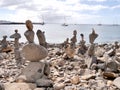 Beach art piles of rocks looking out over the bay at Playa Blanca Lanzarote