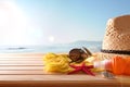 Beach articles on a table wooden slats and sea background