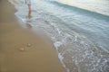 Beach background.Sand and turquoise foamy sea water