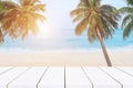 beach background,top of wood table with blurred sea and coconut tree background Royalty Free Stock Photo