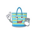 Beach bag cartoon character speaking on phone Royalty Free Stock Photo