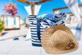 Beach bag with a straw hat sun , towel on Royalty Free Stock Photo