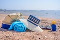 Beach Bag and Sun Hat on Sunny Sandy Beach Royalty Free Stock Photo