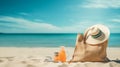 Beach Bag and Supplies for Day at the Beach on Shore with Deserted Beach in Background - Sun Hat, Flip Flops, Towel, Sunscreen Royalty Free Stock Photo