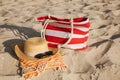 Beach bag, towel, hat and sunglasses on sand Royalty Free Stock Photo