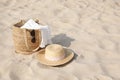 Beach bag, towel, sunglasses and hat on sand, space for text Royalty Free Stock Photo