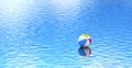 Beach ball floating on blue water