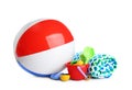 Beach ball, towel and set of plastic toys Royalty Free Stock Photo