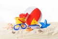 Beach ball and toys in sand Royalty Free Stock Photo