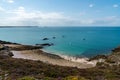 Beach and bay with lilac heath meadow on the wild coast of Brittany Royalty Free Stock Photo