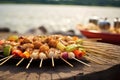 beach bbq with scallops and colorful skewers