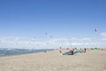 Beach Beauduc : Tourists and locals kitesurfing on large, remote beach with fine sand, popular destination in Southern France