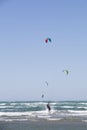 Beach Beauduc : Tourists and locals kitesurfing on large, remote beach with fine sand, popular destination in Southern France