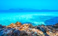 Beach, beautiful panoramic sea view, with clean water, blue sky and some brown rocks Royalty Free Stock Photo