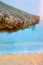 Beach beautiful thatched umbrellas and bright turquoise sea, great recreation and relaxation. tropical paradise. Royalty Free Stock Photo