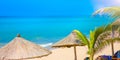 Beach beautiful thatched umbrellas and bright turquoise sea, great recreation and relaxation. tropical paradise. Royalty Free Stock Photo