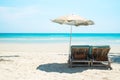 Beach bed with umbrella on white sand beach Royalty Free Stock Photo