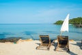 Beach bed with umbrella on white sand beach Royalty Free Stock Photo