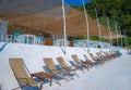 Beach beds at crystal sand of white marble