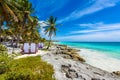 Beach beds under the palm trees on paradise beach at tropical Resort. Riviera Maya - Caribbean coast at Tulum in Quintana Roo, Royalty Free Stock Photo