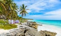 Beach beds under the palm trees on paradise beach at tropical Resort. Riviera Maya - Caribbean coast at Tulum in Quintana Roo, Royalty Free Stock Photo