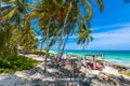 Beach beds under the palm trees on paradise beach at tropical Resort. Riviera Maya - Caribbean coast at Tulum in Quintana Roo, Royalty Free Stock Photo