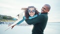 Beach, black family and daughter flying with her father while playing fantasy or pretend with imagination. Portrait, fun