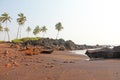 Beach with black sand and palm trees. Dark brown volcanic sand a Royalty Free Stock Photo