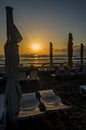 Beach of Black Sea from Mamaia, Romania with sunbeds and umbrellas, blue clear water and golden sand at sunrise Royalty Free Stock Photo