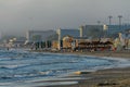 Beach of Black Sea from Mamaia, Romania with sunbeds and umbrellas, foggy day. Royalty Free Stock Photo