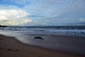 Beach and blue cloudy sky by the sea on sunset Royalty Free Stock Photo