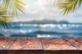 Beach blurred background with palm leaves background with vintage old wood table Royalty Free Stock Photo