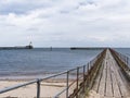 Beach at Blyth, Northumberland, UK with pier, lighthouse and copy space Royalty Free Stock Photo