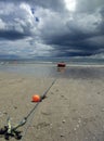 Beach boat with storm clouds