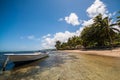 Tropical island beach and boat Royalty Free Stock Photo