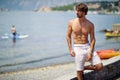 Beach body fit handsome man with pack abs shirtless on summer Royalty Free Stock Photo