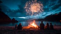 Beach Bonfire with Friends Watching Fireworks Over the Ocean Royalty Free Stock Photo