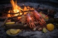 beach bonfire with lobster and lemon garnish Royalty Free Stock Photo