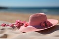 Beach bound style Pink straw hat on sandy shores, perfect for holidays