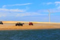 Beach buggies and Wind turbine on Dunes / Galinhos, Brazil
