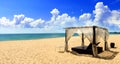 Beach cabana on sand facing open sea Royalty Free Stock Photo