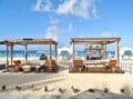 Beach cabanas on a white sandy beach