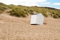 A beach cabin overthrown by a storm Royalty Free Stock Photo