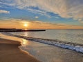 Beach on calm Baltic Sea under scenic sunset sky Royalty Free Stock Photo