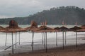 Beach canopies at winter. Off-season travel abstract background