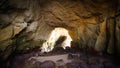 Beach Cave with Sun Shining Inside