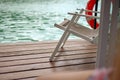 Beach chair on balcony near lake