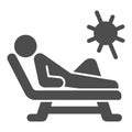 Beach chair and a man relaxing in sun solid icon, Aquapark concept, Man sunbathing sign on white background, Person Royalty Free Stock Photo