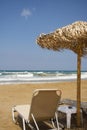 Beach chair by the sea in sunny day. Romantic mood. Travel paradise concept